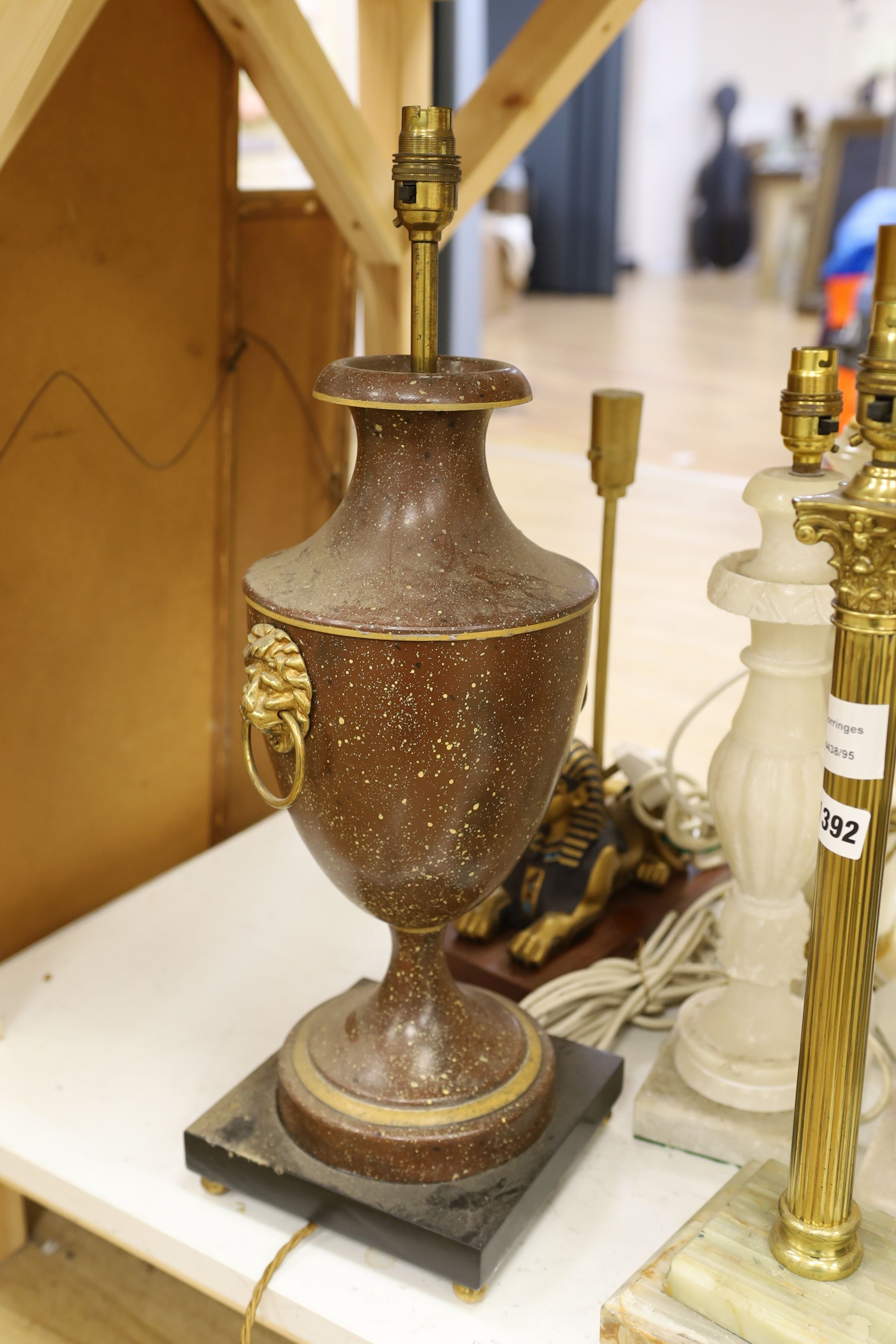 A selection of assorted table lamps including a sphinx-ed base and other decorative bases